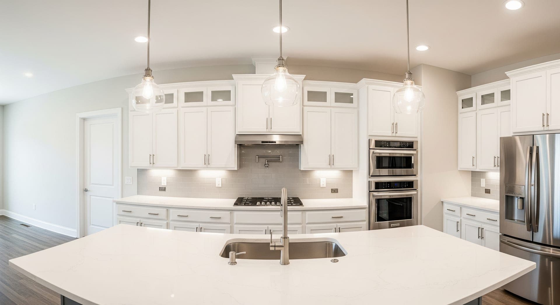 Newly remodeled kitchen with quartz counters and modern cabinets