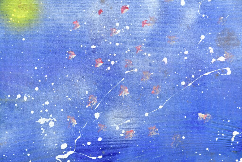 Paint splatter on blue wooden wall. interior, paint droplets, texture, wood, acrylic, blue, shape